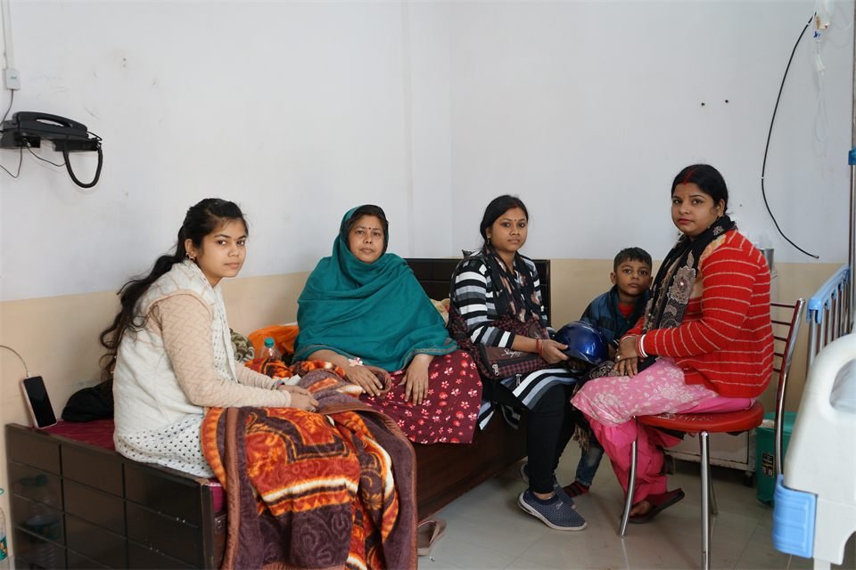 Patient ward with families and visitors at MR Hospital